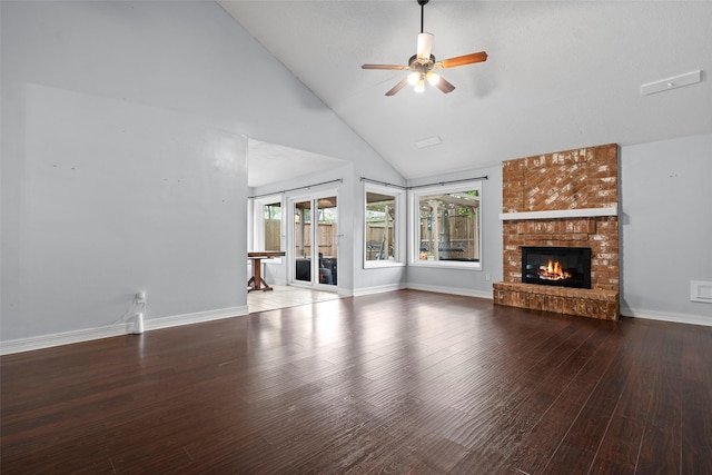 7611 Creekfield Dr, Spring, TX 77379 - unfurnished living room with wood finished floors, a fireplace, ceiling fan, high vaulted ceiling, and baseboards