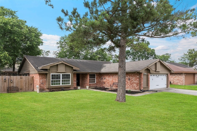 7611 Creekfield Dr, Spring, TX 77379 - ranch-style house featuring asphalt driveway, brick siding, and an attached garage