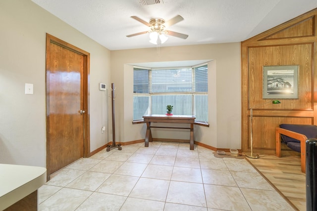 16135 Spinnaker Dr, Crosby, TX 77532 - foyer featuring a ceiling fan, light tile patterned flooring, and a textured ceiling