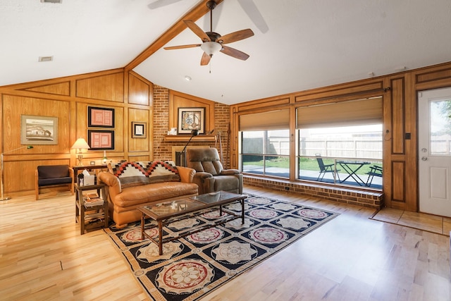 16135 Spinnaker Dr, Crosby, TX 77532 - living room featuring ceiling fan, light wood-type flooring, and wood walls