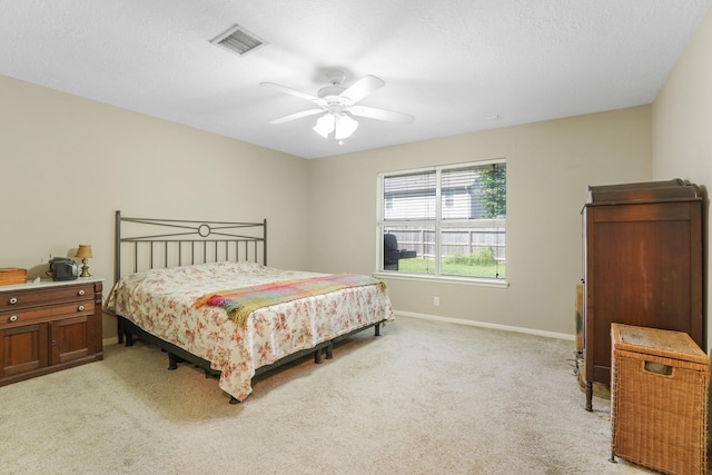 16135 Spinnaker Dr, Crosby, TX 77532 - bedroom featuring light colored carpet, baseboards, a ceiling fan, and a textured ceiling