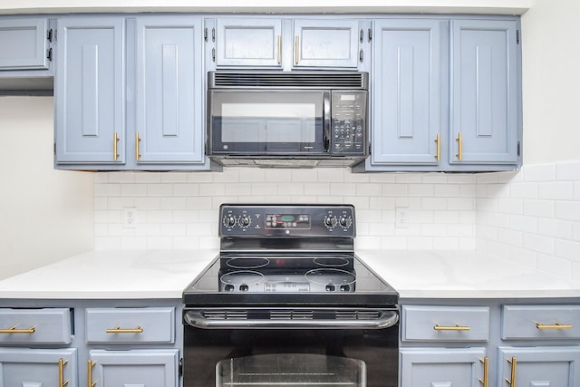 10378 Briar Forest Dr Unit 32/5, Houston, TX 77042 - kitchen featuring black appliances, light countertops, and decorative backsplash