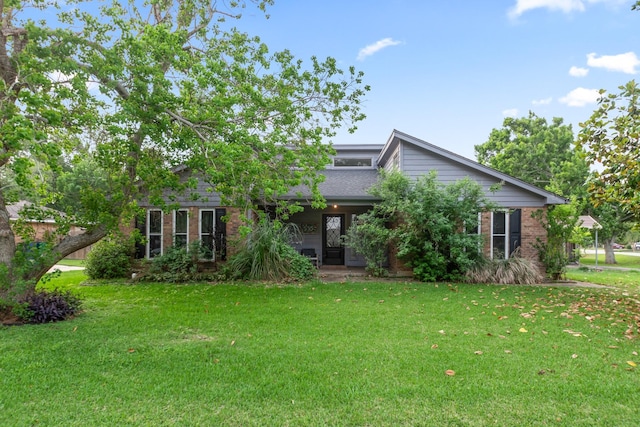535 Oyster Creek Dr, Richwood, TX 77531 - view of front facade featuring a front yard and brick siding