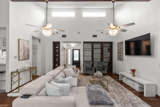 535 Oyster Creek Dr, Richwood, TX 77531 - living area featuring a towering ceiling, a ceiling fan, wood finished floors, and built in features
