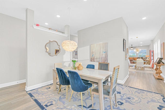 10702 Pleasant View Dr, Missouri City, TX 77459 - dining room featuring light wood-type flooring, baseboards, recessed lighting, and a chandelier