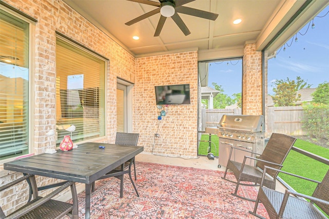 10702 Pleasant View Dr, Missouri City, TX 77459 - view of patio with area for grilling, ceiling fan, fence, and outdoor dining space