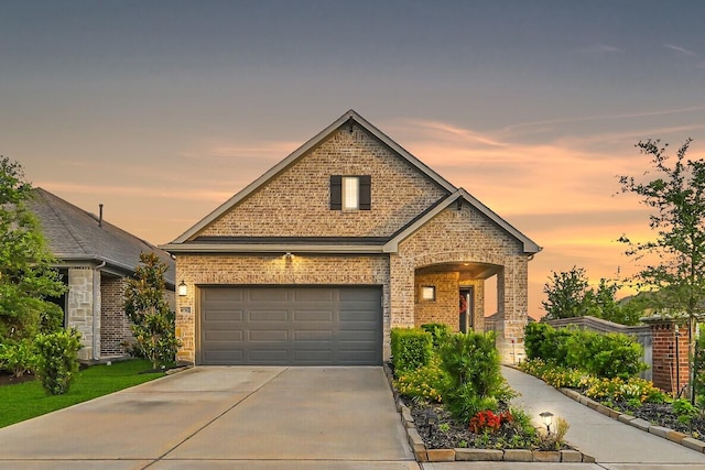 10702 Pleasant View Dr, Missouri City, TX 77459 - view of front of property featuring brick siding, concrete driveway, and a garage