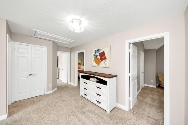 1140 Bartlett Rd, Katy, TX 77493 - hallway with attic access, light colored carpet, and baseboards