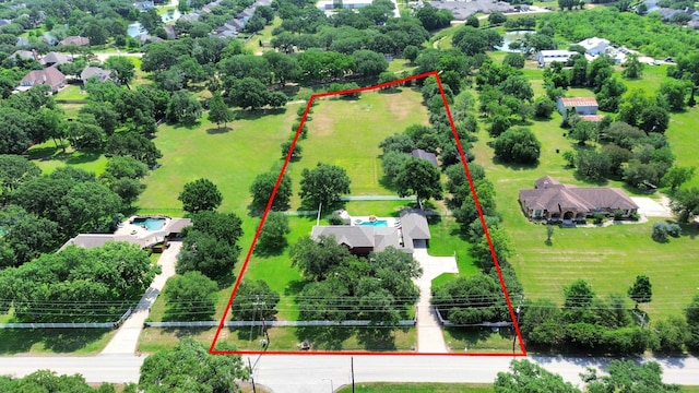 1140 Bartlett Rd, Katy, TX 77493 - aerial view of property and surrounding area with property boundaries highlighted and a tree filled landscape
