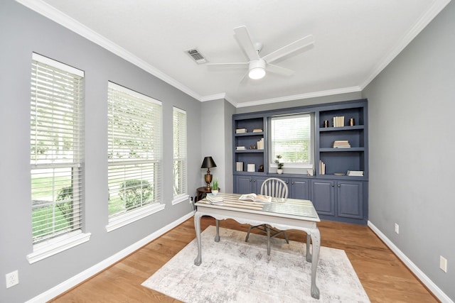 1140 Bartlett Rd, Katy, TX 77493 - office with light wood finished floors, a ceiling fan, crown molding, baseboards, and built in features
