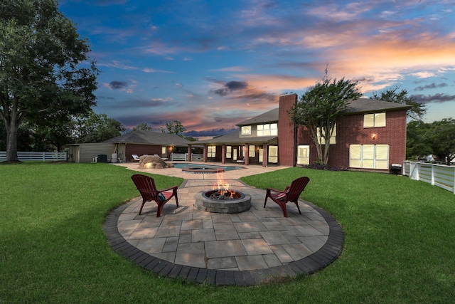1140 Bartlett Rd, Katy, TX 77493 - yard at dusk featuring an outdoor fire pit, a patio, a gazebo, and a swimming pool