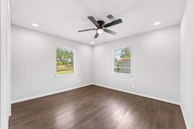 13430 Orleans St, Houston, TX 77015 - unfurnished room featuring healthy amount of natural light, dark wood finished floors, baseboards, recessed lighting, and a ceiling fan