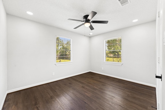 13430 Orleans St, Houston, TX 77015 - empty room with ceiling fan, baseboards, dark wood finished floors, recessed lighting, and a textured ceiling