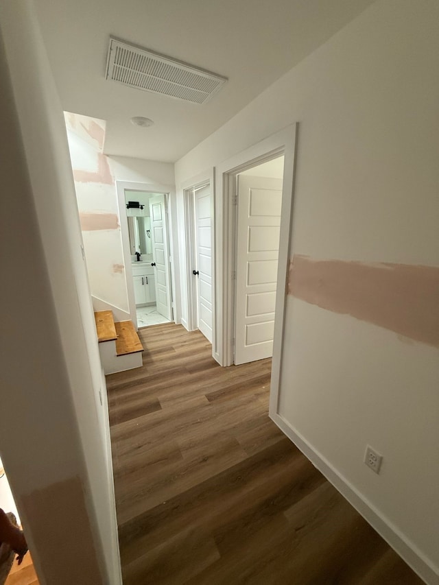 8019 Birmingham St, Houston, TX 77028 - hallway with wood finished floors and baseboards