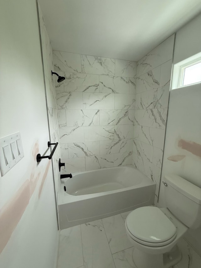 8019 Birmingham St, Houston, TX 77028 - full bathroom with marble look tiles, toilet, and shower / bathtub combination