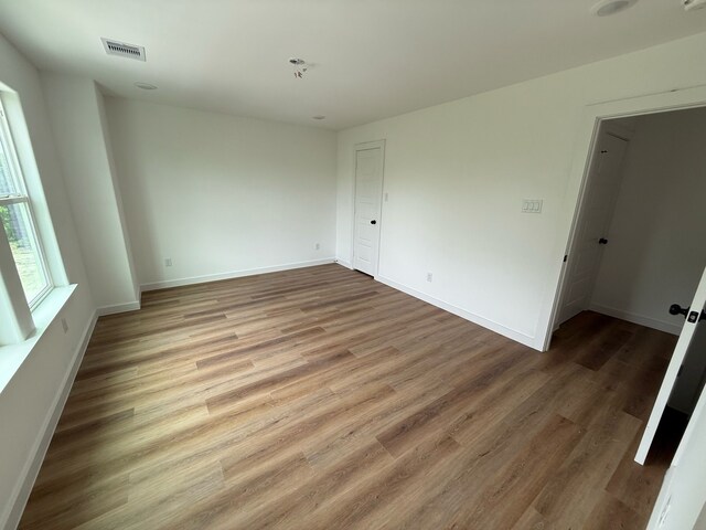 8019 Birmingham St, Houston, TX 77028 - empty room featuring wood finished floors and baseboards