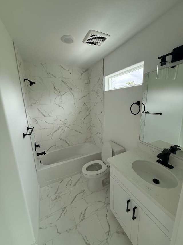 8019 Birmingham St, Houston, TX 77028 - full bath featuring toilet,  shower combination, vanity, and marble look tiles