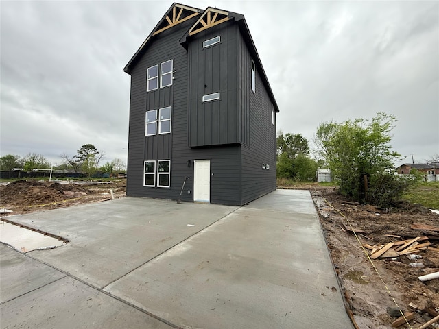 8019 Birmingham St, Houston, TX 77028 - view of home's exterior featuring a patio area and board and batten siding