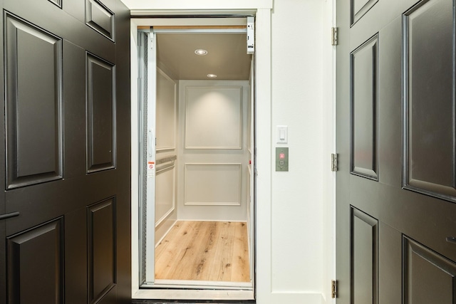 2176 Hwy 87, Gilchrist, TX 77617 - elevator featuring wood finished floors and recessed lighting