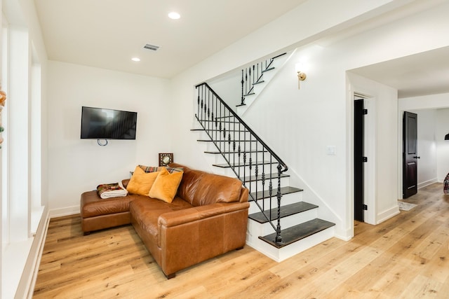 2176 Hwy 87, Gilchrist, TX 77617 - living room featuring wood finished floors, stairway, recessed lighting, and baseboards