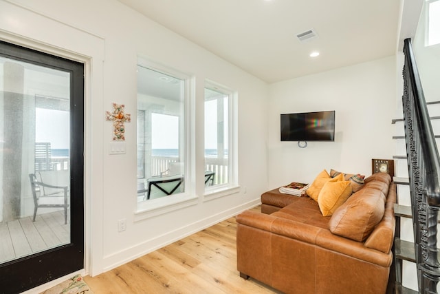 2176 Hwy 87, Gilchrist, TX 77617 - living area with wood finished floors, baseboards, and recessed lighting