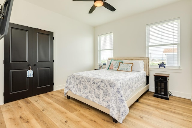 2176 Hwy 87, Gilchrist, TX 77617 - bedroom featuring light wood-style flooring, baseboards, and ceiling fan