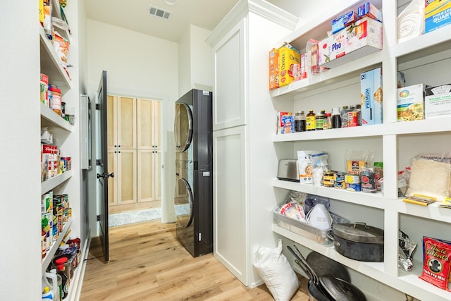 2176 Hwy 87, Gilchrist, TX 77617 - pantry with stacked washing machine and dryer