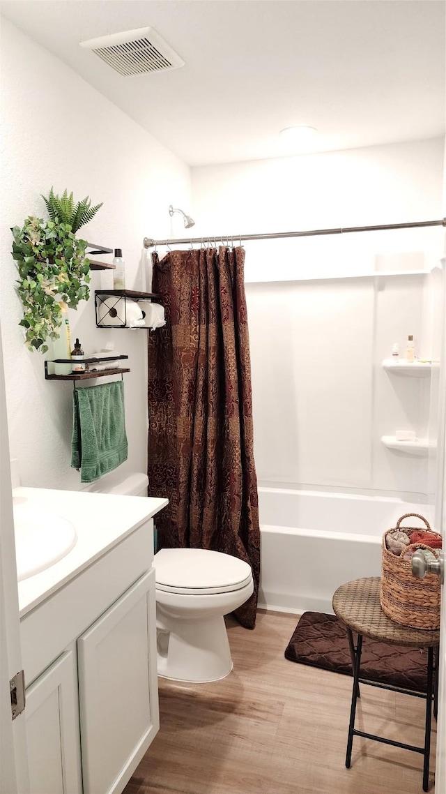 20822 Masella Ridge Dr, New Caney, TX 77357 - bathroom with wood finished floors, toilet, shower / bath combination with curtain, and vanity