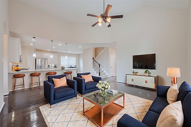 16747 Highland Country Dr, Cypress, TX 77433 - living room with hardwood / wood-style floors, stairs, a ceiling fan, high vaulted ceiling, and recessed lighting