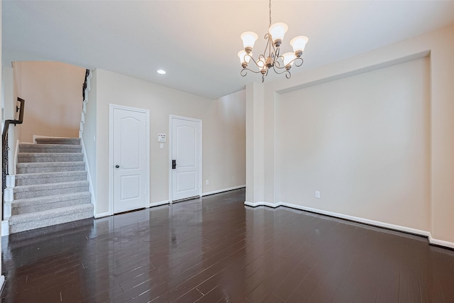 16747 Highland Country Dr, Cypress, TX 77433 - spare room featuring a chandelier, stairs, dark wood-style floors, and recessed lighting