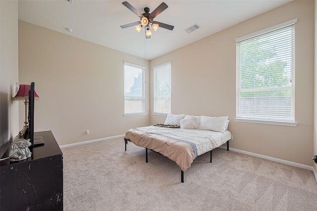 16747 Highland Country Dr, Cypress, TX 77433 - carpeted bedroom featuring multiple windows and a ceiling fan