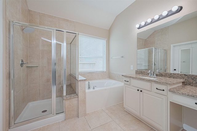 16747 Highland Country Dr, Cypress, TX 77433 - full bath featuring vanity, a garden tub, a shower stall, lofted ceiling, and tile patterned flooring