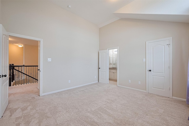 16747 Highland Country Dr, Cypress, TX 77433 - unfurnished bedroom with high vaulted ceiling, carpet, and connected bathroom