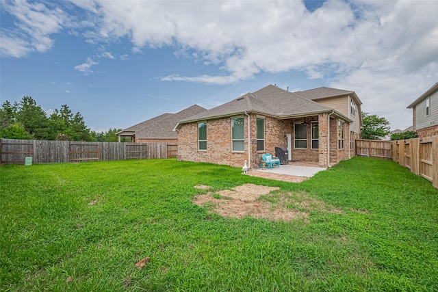 16747 Highland Country Dr, Cypress, TX 77433 - rear view of property featuring brick siding, a patio, a fenced backyard, and roof with shingles