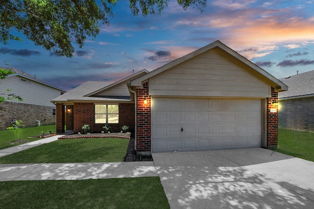 5818 Taylan Ln, Rosenberg, TX 77471 - ranch-style home featuring brick siding, a front lawn, an attached garage, and driveway