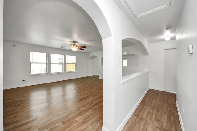 5818 Taylan Ln, Rosenberg, TX 77471 - spare room featuring ceiling fan, light wood-style floors, and baseboards