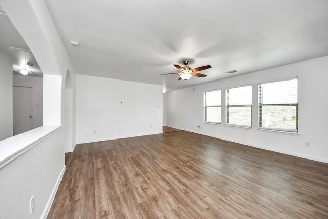 5818 Taylan Ln, Rosenberg, TX 77471 - unfurnished room with ceiling fan, baseboards, and wood finished floors