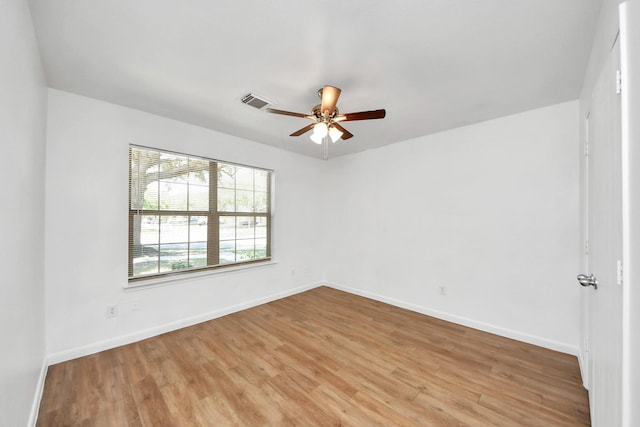 5818 Taylan Ln, Rosenberg, TX 77471 - spare room featuring ceiling fan, light wood-style floors, and baseboards