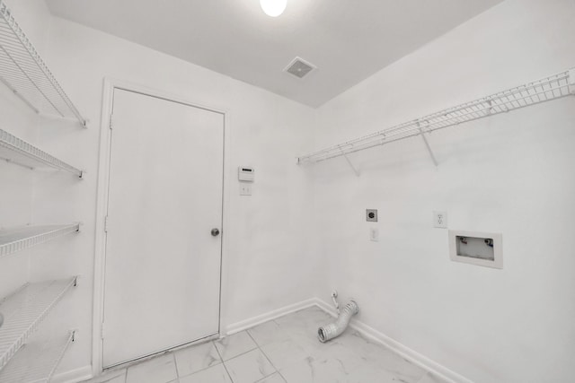 5818 Taylan Ln, Rosenberg, TX 77471 - laundry area featuring washer hookup, electric dryer hookup, baseboards, light marble finish floors, and hookup for a gas dryer