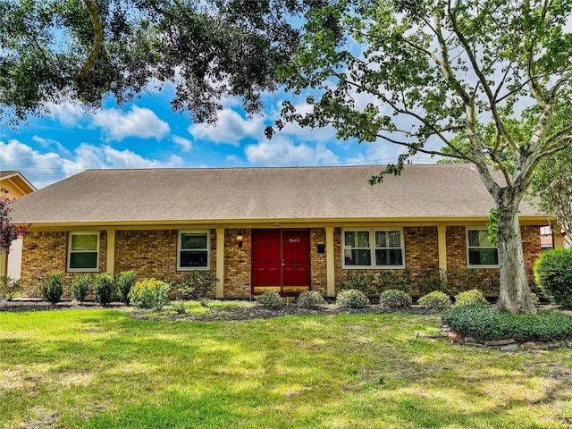 9647 Winsome Ln, Houston, TX 77063 - view of front of house featuring a front yard, brick siding, and a shingled roof