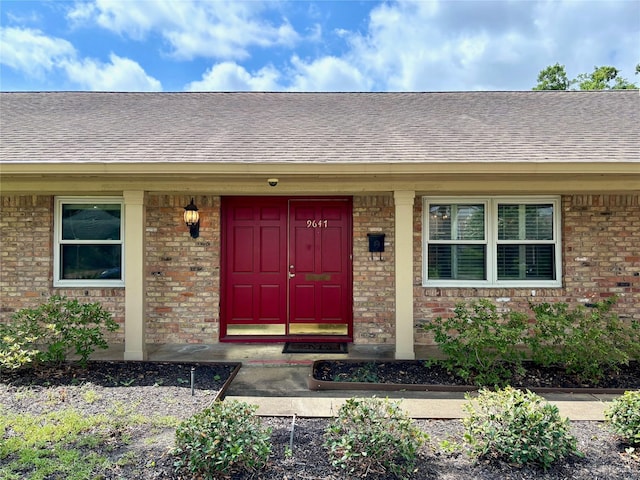9647 Winsome Ln, Houston, TX 77063 - entrance to property featuring a shingled roof and brick siding