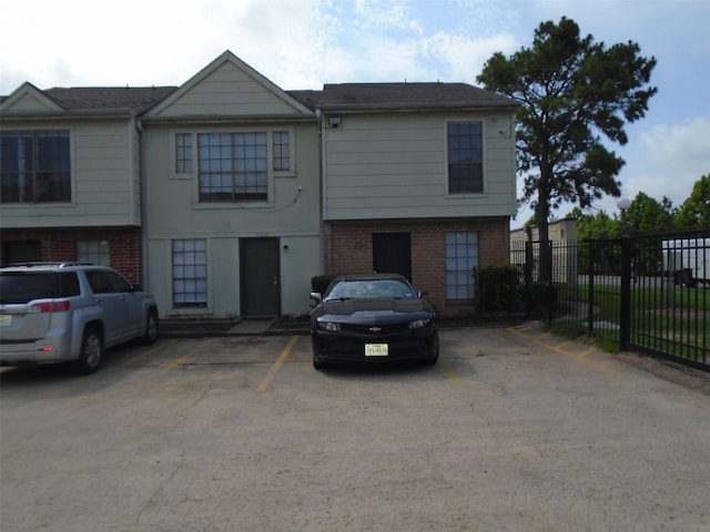 12651 Windsor Village Dr, Houston, TX 77071 - townhome / multi-family property featuring fence, uncovered parking, and brick siding
