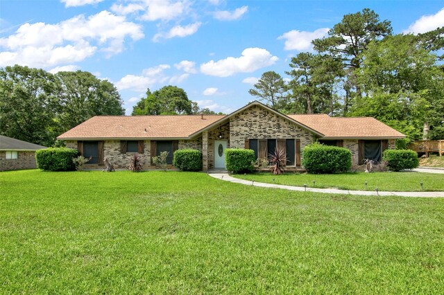 206 Verna St, Jasper, TX 75951 - single story home with a front lawn and brick siding