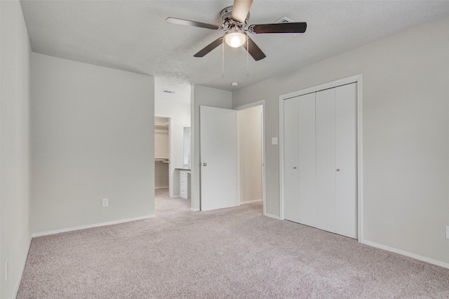 206 Verna St, Jasper, TX 75951 - unfurnished bedroom with carpet, baseboards, ceiling fan, and a closet