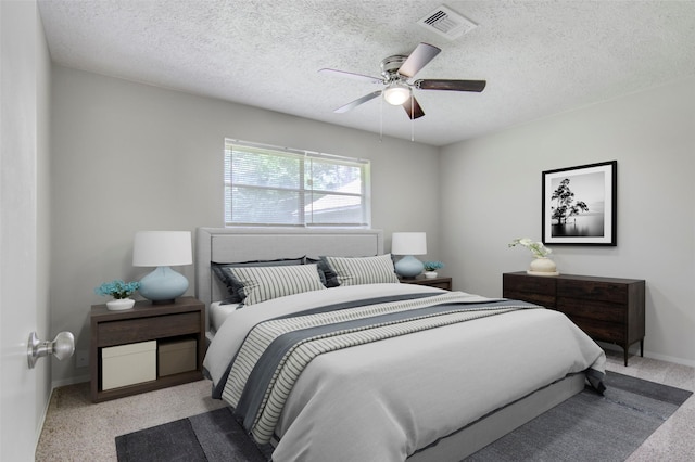 206 Verna St, Jasper, TX 75951 - bedroom with carpet flooring, baseboards, a textured ceiling, and a ceiling fan