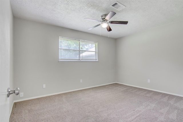 206 Verna St, Jasper, TX 75951 - unfurnished room featuring ceiling fan, carpet flooring, a textured ceiling, and baseboards