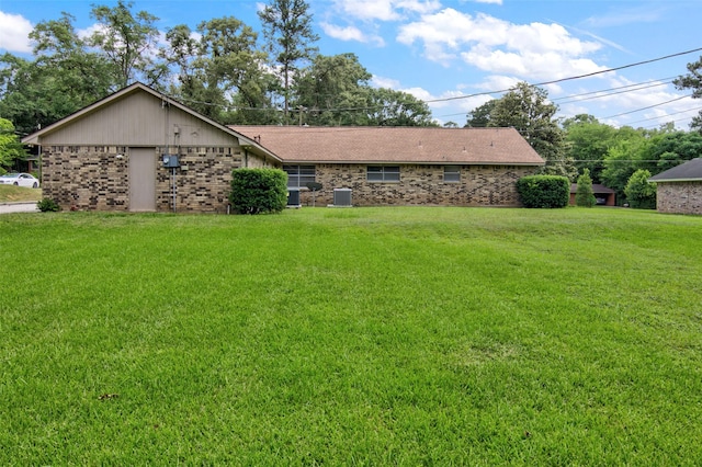 206 Verna St, Jasper, TX 75951 - view of front of property featuring a front yard, brick siding, and central AC