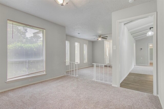 206 Verna St, Jasper, TX 75951 - spare room featuring carpet, ceiling fan, a textured ceiling, and baseboards