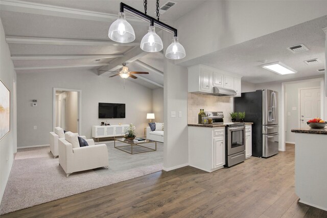 206 Verna St, Jasper, TX 75951 - kitchen with stainless steel appliances, white cabinetry, wood finished floors, and open floor plan