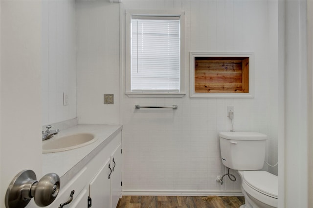 206 Verna St, Jasper, TX 75951 - half bath featuring wood finished floors, toilet, and vanity